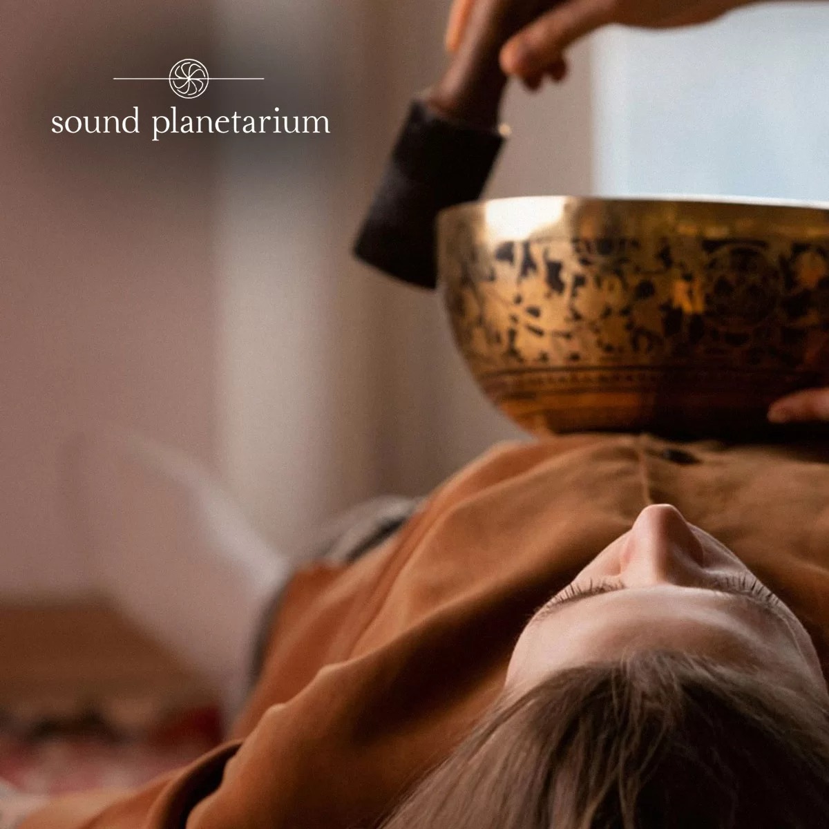 Planet singing bowls arranged for a sound-healing therapy session